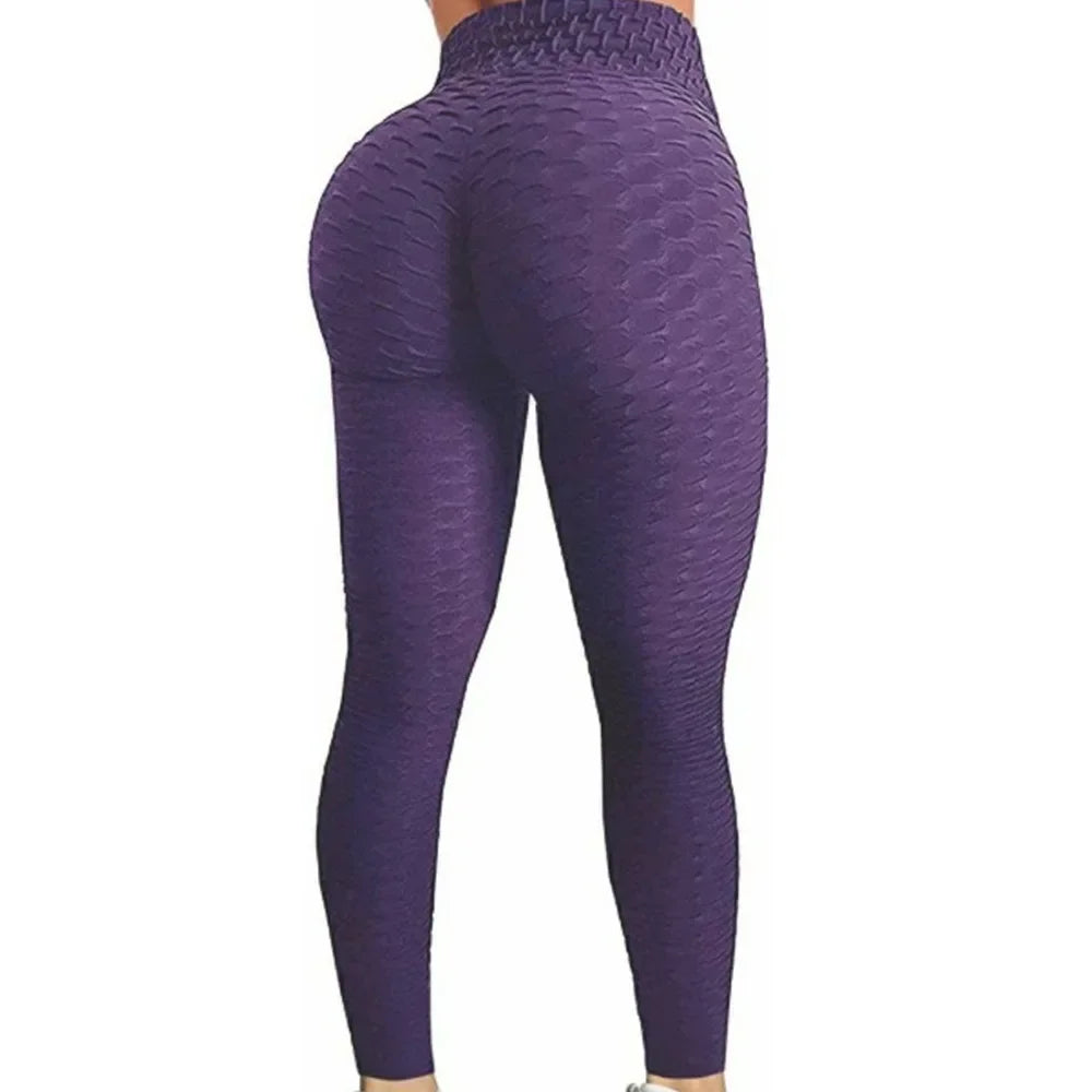 Damen Sportleggings in Lila mit strukturierter Oberfläche in kompletter Rückansicht.