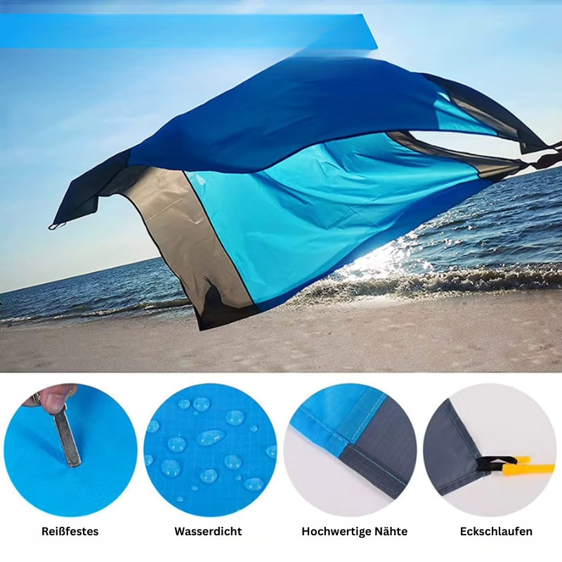 Strapazierfähige Picknickdecke mit wasserdichtem Material, verstärkten Nähten und Eckschlaufen zur Befestigung.