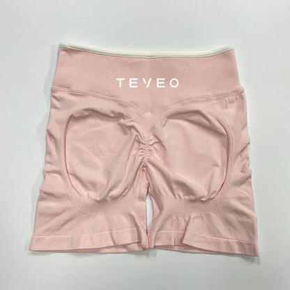 Rosa nahtlose Damen Sport Shorts mit Scrunch Butt und hohem Bund in Rückansicht.